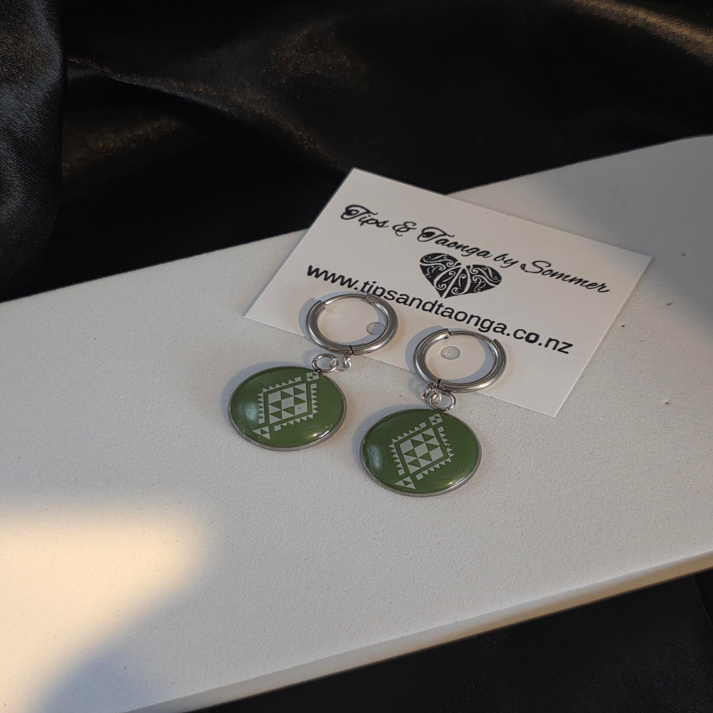 Olive green tāniko huggies